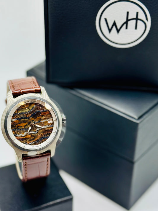 Hand-forged Damascus wristwatch with fossil Woolly Mammoth dial, by William Henry